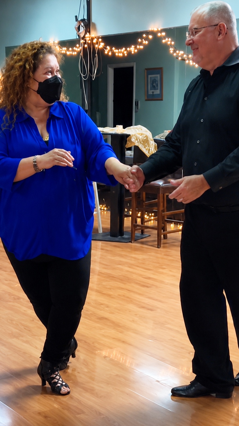A DanceFun instructor guiding a student