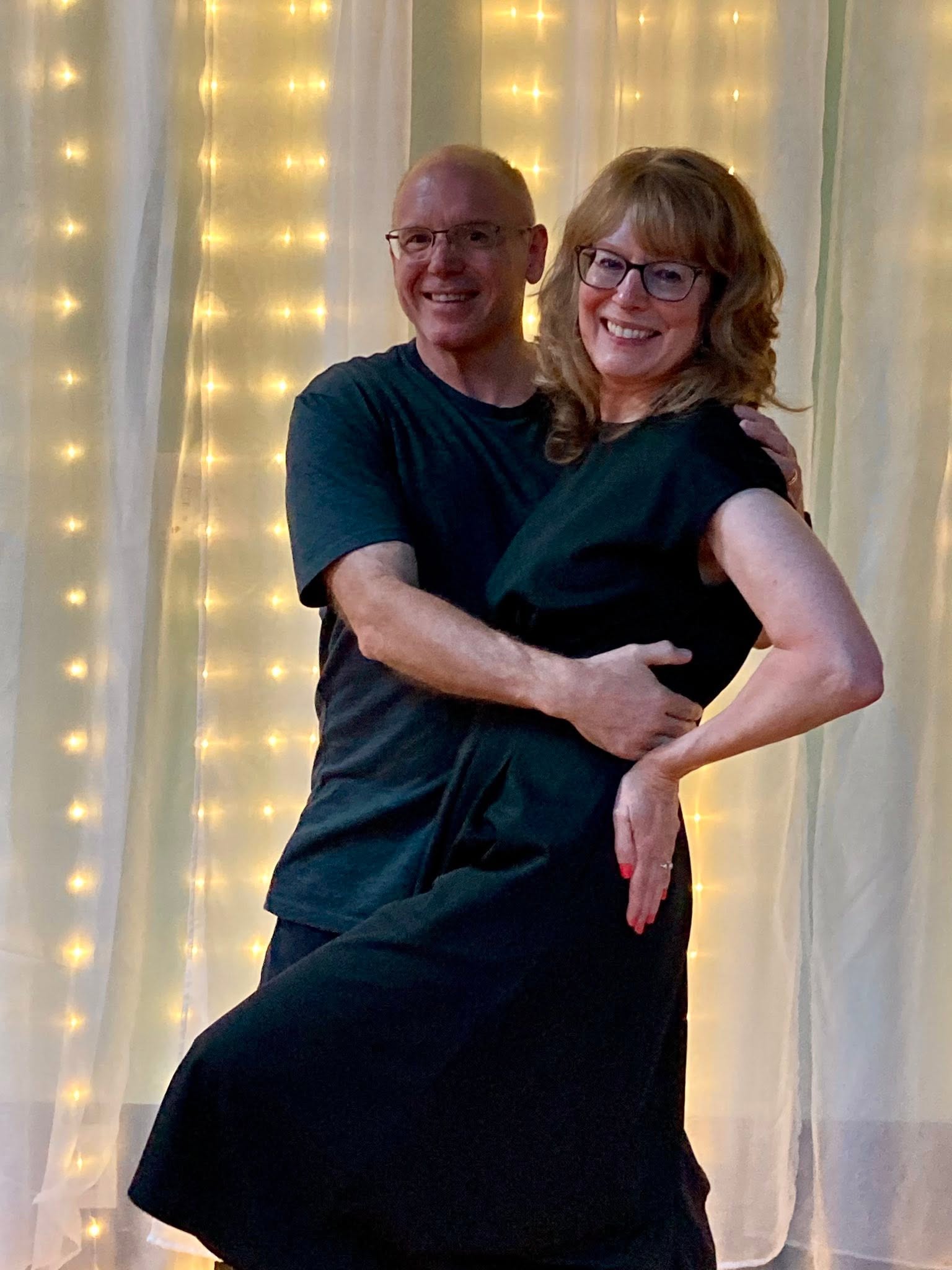 DanceFun students smiling together while dancing